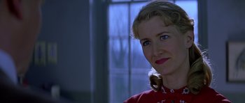 Movie still from “October Sky” (1999), directed by Joe Johnston – A person wearing a red shirt; Close Up shot, Over the shoulder angle