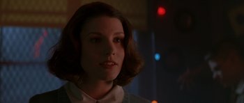 Movie still from “October Sky” (1999), directed by Joe Johnston – A young woman with short brown hair wearing a white shirt; Close Up shot, Low angle