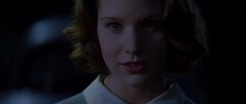 Movie still from “October Sky” (1999), directed by Joe Johnston – A woman's face in the dark; Close Up shot, Low angle