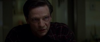 Movie still from “October Sky” (1999), directed by Joe Johnston – A person with a bruise on his face; Close Up shot, Over the shoulder angle