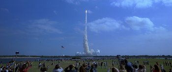 Movie still from “October Sky” (1999), directed by Joe Johnston – A crowd of people watching a rocket launch; Extreme Wide shot, Low angle