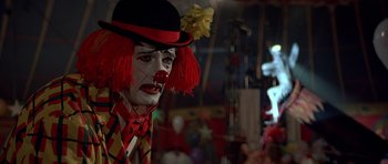 Movie still from “Octopussy” (1983), directed by John Glen – A clown's face in a room; Close Up shot, Low angle