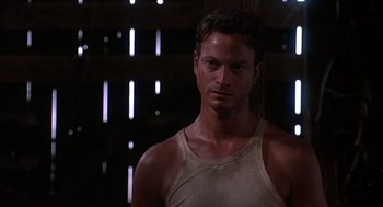 Movie still from “Of Mice and Men” (1992), directed by Gary Sinise – A person wearing a tank top; Close Up shot, Low angle