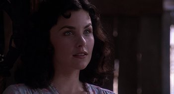 Movie still from “Of Mice and Men” (1992), directed by Gary Sinise – A person wearing a shirt; Close Up shot, Over the shoulder angle