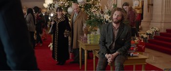Movie still from “Office Christmas Party” (2016), directed by Will Speck – A man and a woman standing in front of a christmas tree; Medium shot, Over the shoulder angle