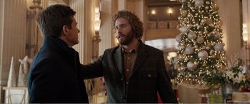 Movie still from “Office Christmas Party” (2016), directed by Will Speck – A man with a beard is talking to another man in a suit; Medium shot, Over the shoulder angle