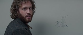 Movie still from “Office Christmas Party” (2016), directed by Will Speck – A person with curly hair; Close Up shot, Over the shoulder angle