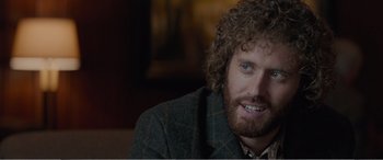 Movie still from “Office Christmas Party” (2016), directed by Will Speck – A person wearing a jacket; Close Up shot, Over the shoulder angle