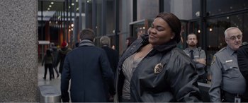 Movie still from “Office Christmas Party” (2016), directed by Will Speck – A woman that is standing in the street; Medium shot, Over the shoulder angle