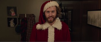 Movie still from “Office Christmas Party” (2016), directed by Will Speck – A man dressed as santa claus for christmas; Close Up shot, Over the shoulder angle