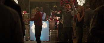 Movie still from “Office Christmas Party” (2016), directed by Will Speck – A group of people standing around a room; Medium shot, Over the shoulder angle