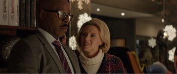 Movie still from “Office Christmas Party” (2016), directed by Will Speck – A man and a woman standing next to each other in front of lights; Close Up shot, Low angle