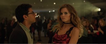 Movie still from “Office Christmas Party” (2016), directed by Will Speck – A man and a woman standing next to each other in a room; Medium shot, Over the shoulder angle