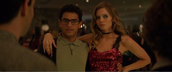 Movie still from “Office Christmas Party” (2016), directed by Will Speck – A man and a woman pose for a picture; Medium shot, Low angle