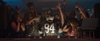 Movie still from “Office Christmas Party” (2016), directed by Will Speck – A group of young people dancing in a room; Medium shot, Low angle