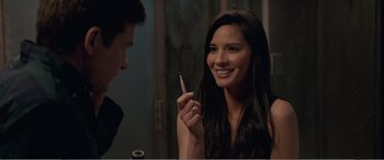 Movie still from “Office Christmas Party” (2016), directed by Will Speck – A woman holding a tooth brush in front of a mirror; Close Up shot, Over the shoulder angle