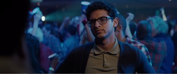 Movie still from “Office Christmas Party” (2016), directed by Will Speck – A man with glasses is looking at the camera; Close Up shot, Low angle