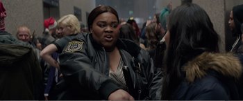 Movie still from “Office Christmas Party” (2016), directed by Will Speck – A woman that is wearing a jacket; Close Up shot, Over the shoulder angle