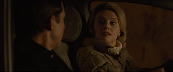 Movie still from “Office Christmas Party” (2016), directed by Will Speck – A young woman sitting in the back seat of a car talking to a young man; Close Up shot, Over the shoulder angle