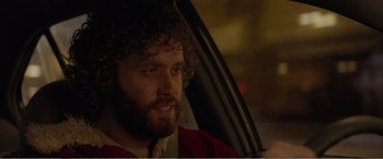 Movie still from “Office Christmas Party” (2016), directed by Will Speck – A person sitting in a car; Close Up shot, Over the shoulder angle