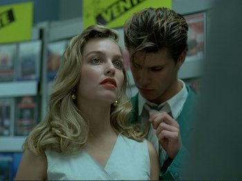 Movie still from “Oh, Woe Is Me” (1993), directed by Jean-Luc Godard – A man and a woman standing next to each other; Close Up shot, Over the shoulder angle