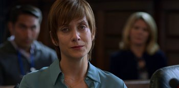 Movie still from “13 Reasons Why” (2017), created by Brian Yorkey – A person with short hair wearing a blue shirt; Close Up shot, Over the shoulder angle