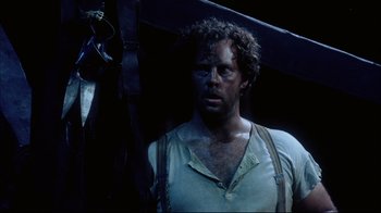 Movie still from “Oklahoma!” (1999), directed by Trevor Nunn – A person holding a pole; Close Up shot, Low angle