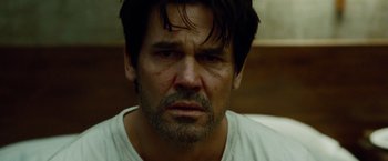 Movie still from “Oldboy” (2013), directed by Spike Lee – A person wearing a white shirt; Close Up shot, Over the shoulder angle