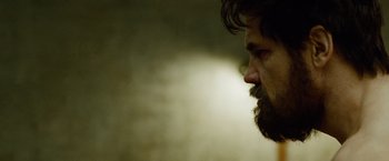 Movie still from “Oldboy” (2013), directed by Spike Lee – A person with a beard; Close Up shot, Over the shoulder angle