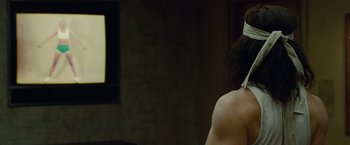 Movie still from “Oldboy” (2013), directed by Spike Lee – A man with a blindfold on his head; Close Up shot, Over the shoulder angle