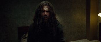 Movie still from “Oldboy” (2013), directed by Spike Lee – A man with long hair and a long beard; Close Up shot, Low angle