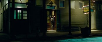 Movie still from “Oldboy” (2013), directed by Spike Lee – A man standing in front of a door at night; Extreme Wide shot, Low angle