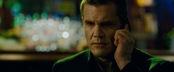 Movie still from “Oldboy” (2013), directed by Spike Lee – A person talking on a cell phone; Close Up shot, Low angle