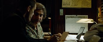 Movie still from “Oldboy” (2013), directed by Spike Lee – A man sitting at a table writing on a piece of paper; Close Up shot, Over the shoulder angle