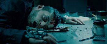 Movie still from “Oldboy” (2013), directed by Spike Lee – A man laying on the ground with blood on his face; Close Up shot, Overhead angle