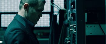 Movie still from “Oldboy” (2013), directed by Spike Lee – A man is looking down at a computer screen; Close Up shot, Low angle