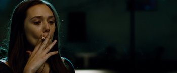 Movie still from “Oldboy” (2013), directed by Spike Lee – A woman with her hand to her mouth; Close Up shot, Low angle