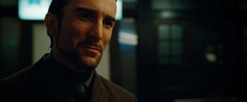 Movie still from “Oldboy” (2013), directed by Spike Lee – A person wearing a suit and tie; Close Up shot, Low angle