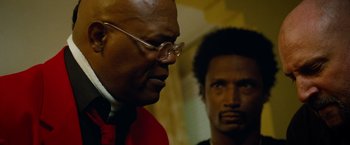 Movie still from “Oldboy” (2013), directed by Spike Lee – A man in a red shirt and a man in a black shirt; Close Up shot, Low angle