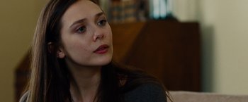 Movie still from “Oldboy” (2013), directed by Spike Lee – A person sitting in a room; Close Up shot, Over the shoulder angle