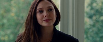 Movie still from “Oldboy” (2013), directed by Spike Lee – A person with long brown hair; Close Up shot, Over the shoulder angle