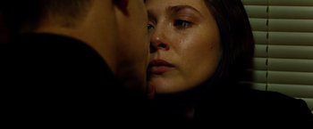 Movie still from “Oldboy” (2013), directed by Spike Lee – A person with their eyes closed crying; Extreme Close Up shot, Low angle