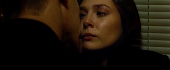 Movie still from “Oldboy” (2013), directed by Spike Lee – A young woman is crying in front of a mirror; Close Up shot, Low angle