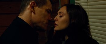 Movie still from “Oldboy” (2013), directed by Spike Lee – A man and a woman face to face in a dark room; Close Up shot, Low angle