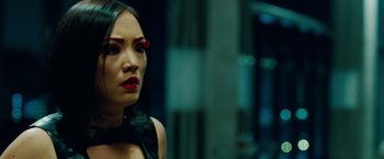 Movie still from “Oldboy” (2013), directed by Spike Lee – A person wearing a dress; Close Up shot, Over the shoulder angle