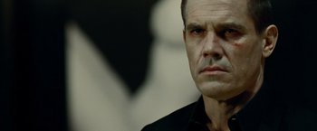 Movie still from “Oldboy” (2013), directed by Spike Lee – A person wearing a black shirt; Close Up shot, Low angle