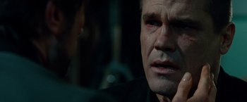 Movie still from “Oldboy” (2013), directed by Spike Lee – A person looking at the camera; Close Up shot, Over the shoulder angle