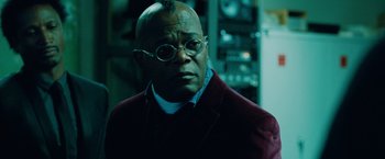 Movie still from “Oldboy” (2013), directed by Spike Lee – A man in a red jacket and white shirt; Close Up shot, Low angle