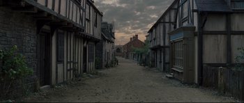 Movie still from “Oliver Twist” (2005), directed by Roman Polanski – An empty street in an old western town; Extreme Wide shot, High angle
