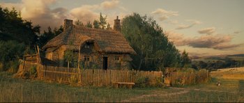 Movie still from “Oliver Twist” (2005), directed by Roman Polanski – An image of an old house in the middle of the day; Extreme Wide shot, Low angle